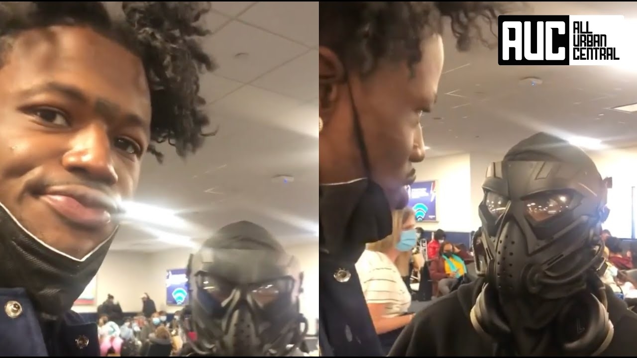 DC Young Fly Confronts Lil Duval For Wearing A Predator Mask In Airport
