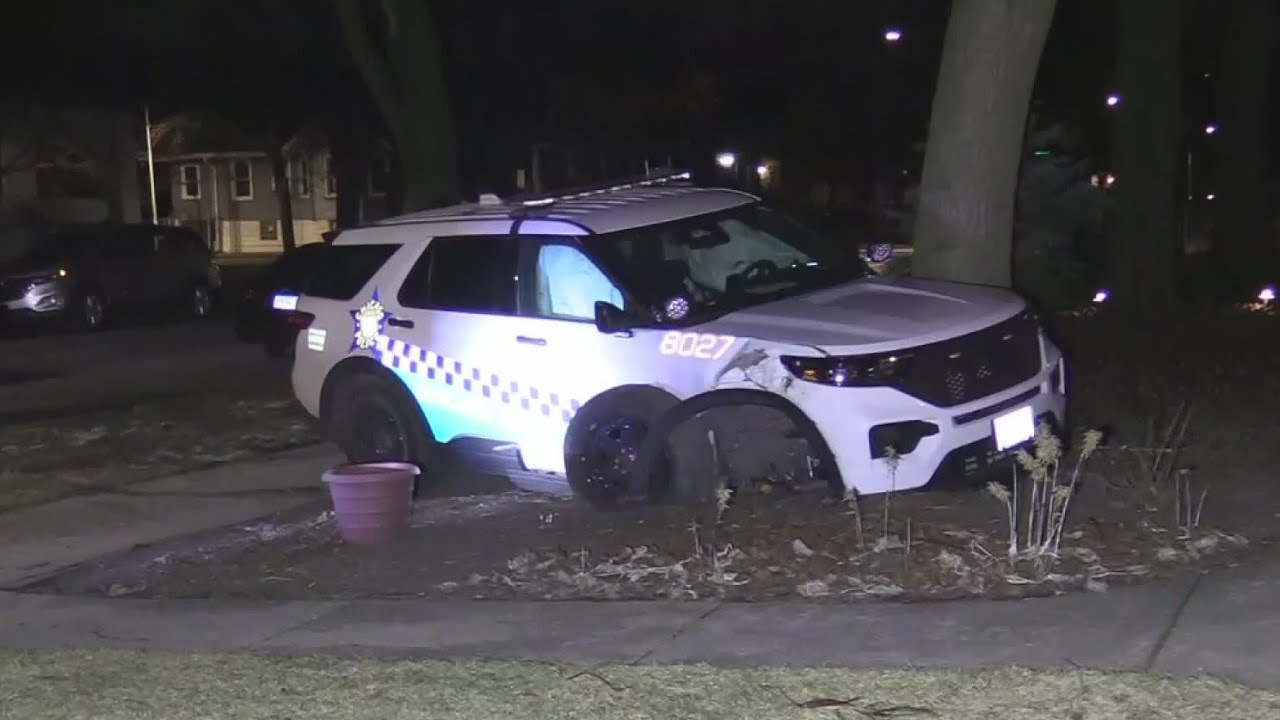 Chicago Police squad car slams into parked car, tree