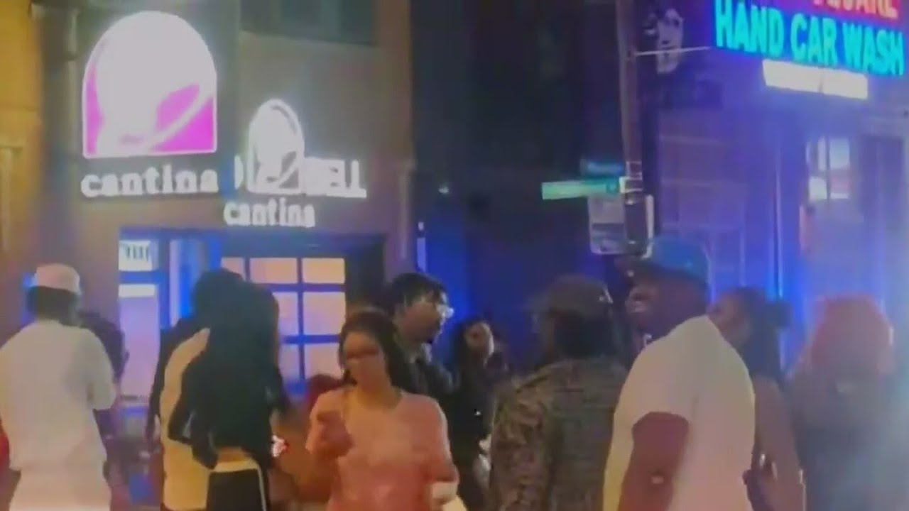Rowdy crowds fill busy Milwaukee Avenue on Chicago's Northwest Side