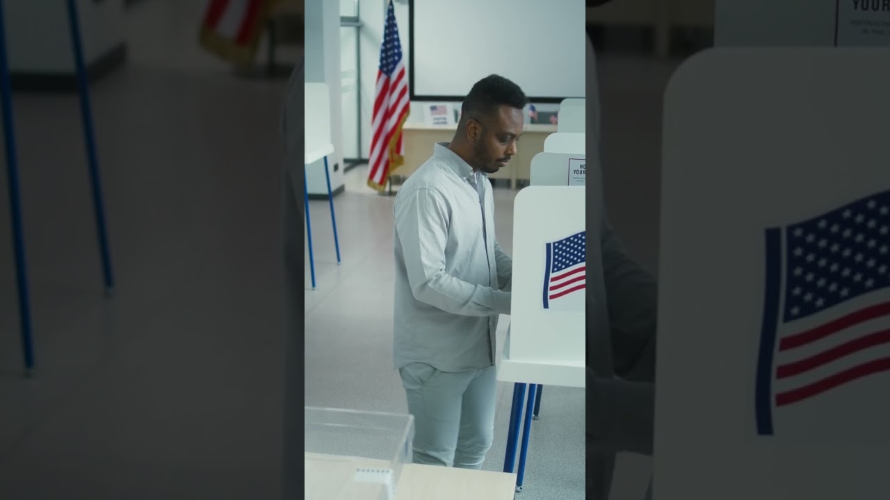 African american man votes in voting booth